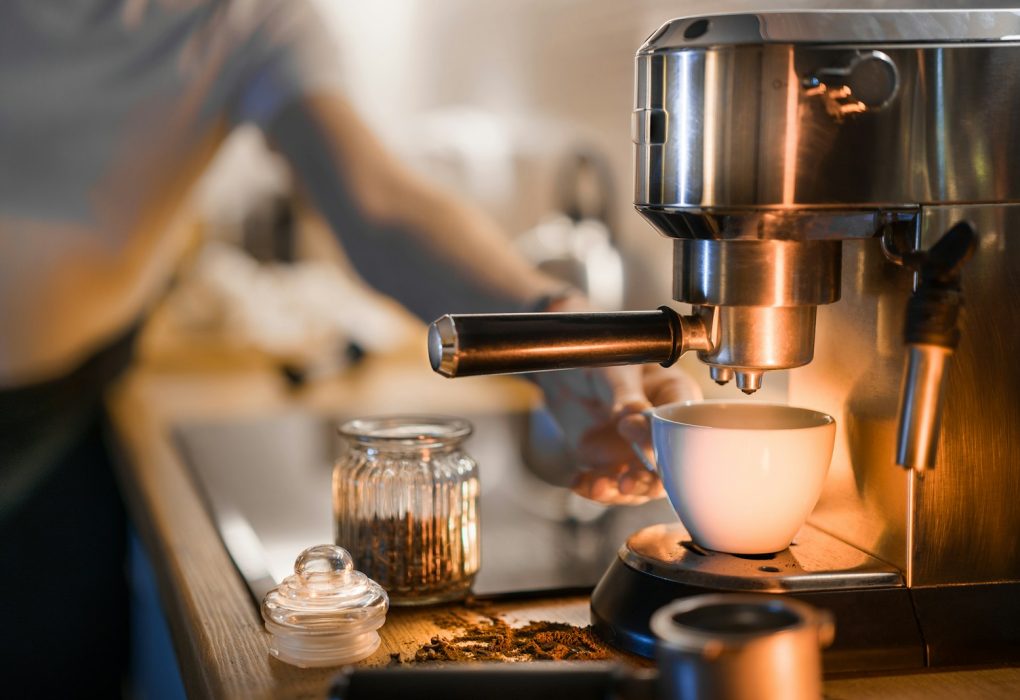 a coffee maker is making a cup of coffee